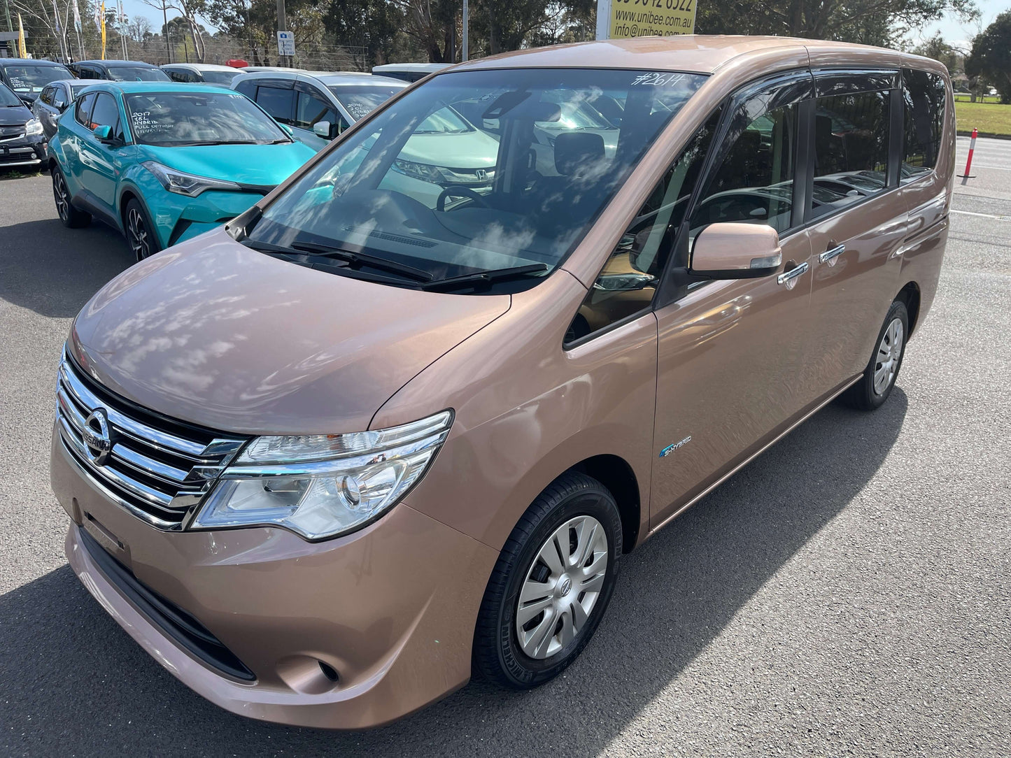 2016 Nissan Serena 2.0L S-Hybrid Highway Star in light brown, showcasing its hybrid efficiency and spacious design.