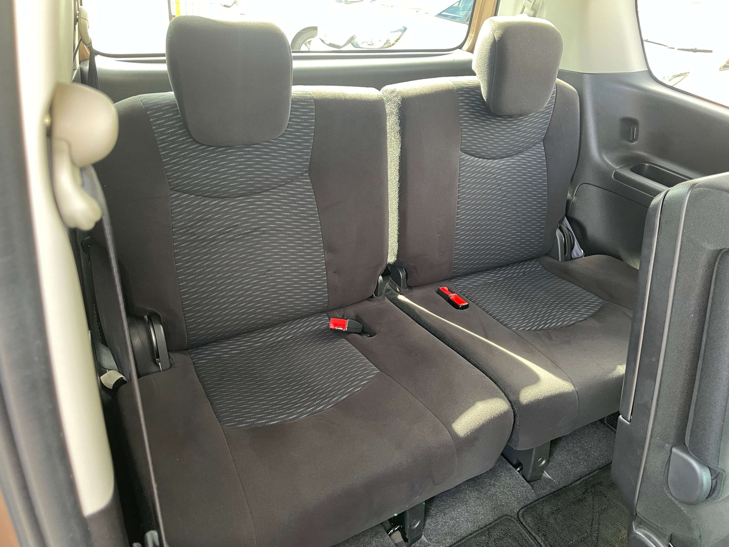 Interior view of back seats in 2016 Nissan Serena 2.0L S-Hybrid Highway Star, showcasing space for 8 passengers.