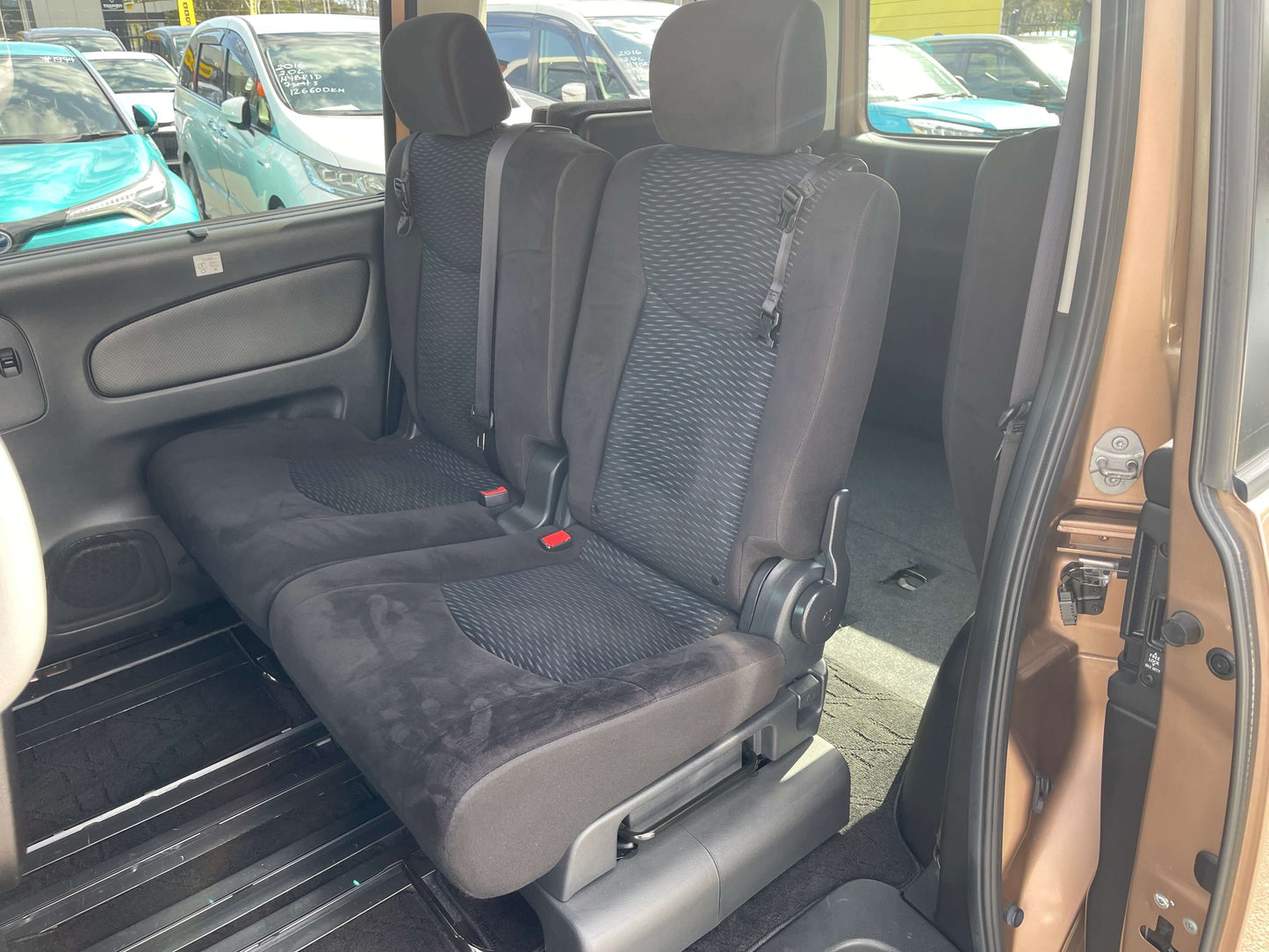 Interior seating of a 2016 Nissan Serena 2.0L S-Hybrid Highway Star showcasing spacious and comfortable back seats.