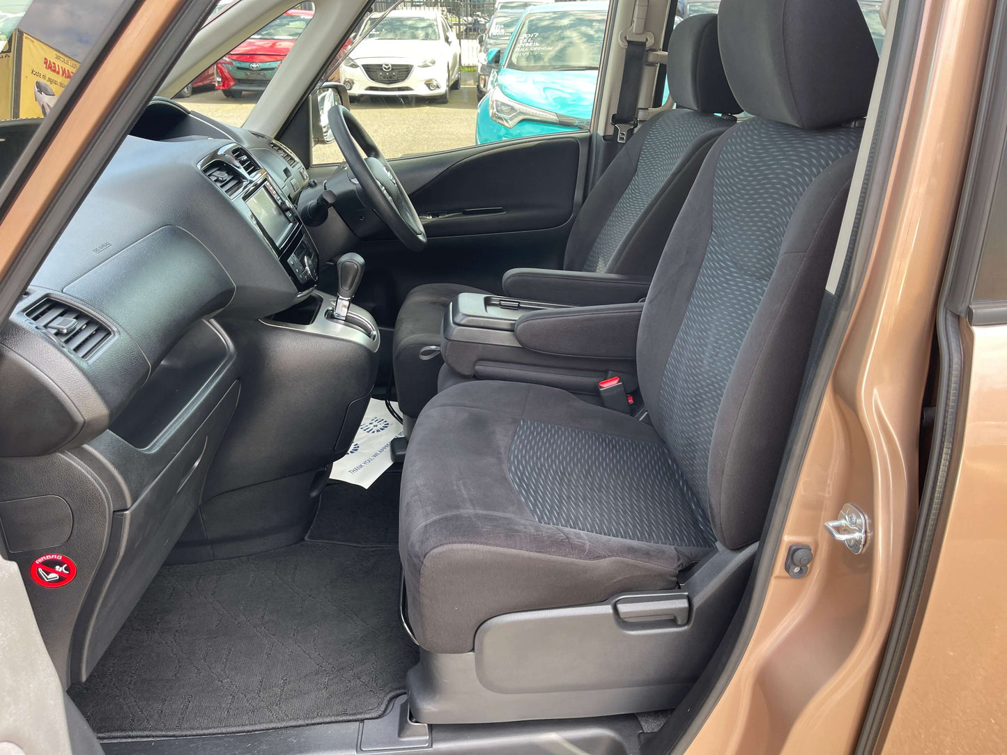 Interior of 2016 Nissan Serena 2.0L S-Hybrid Highway Star with comfortable seating and modern dashboard.