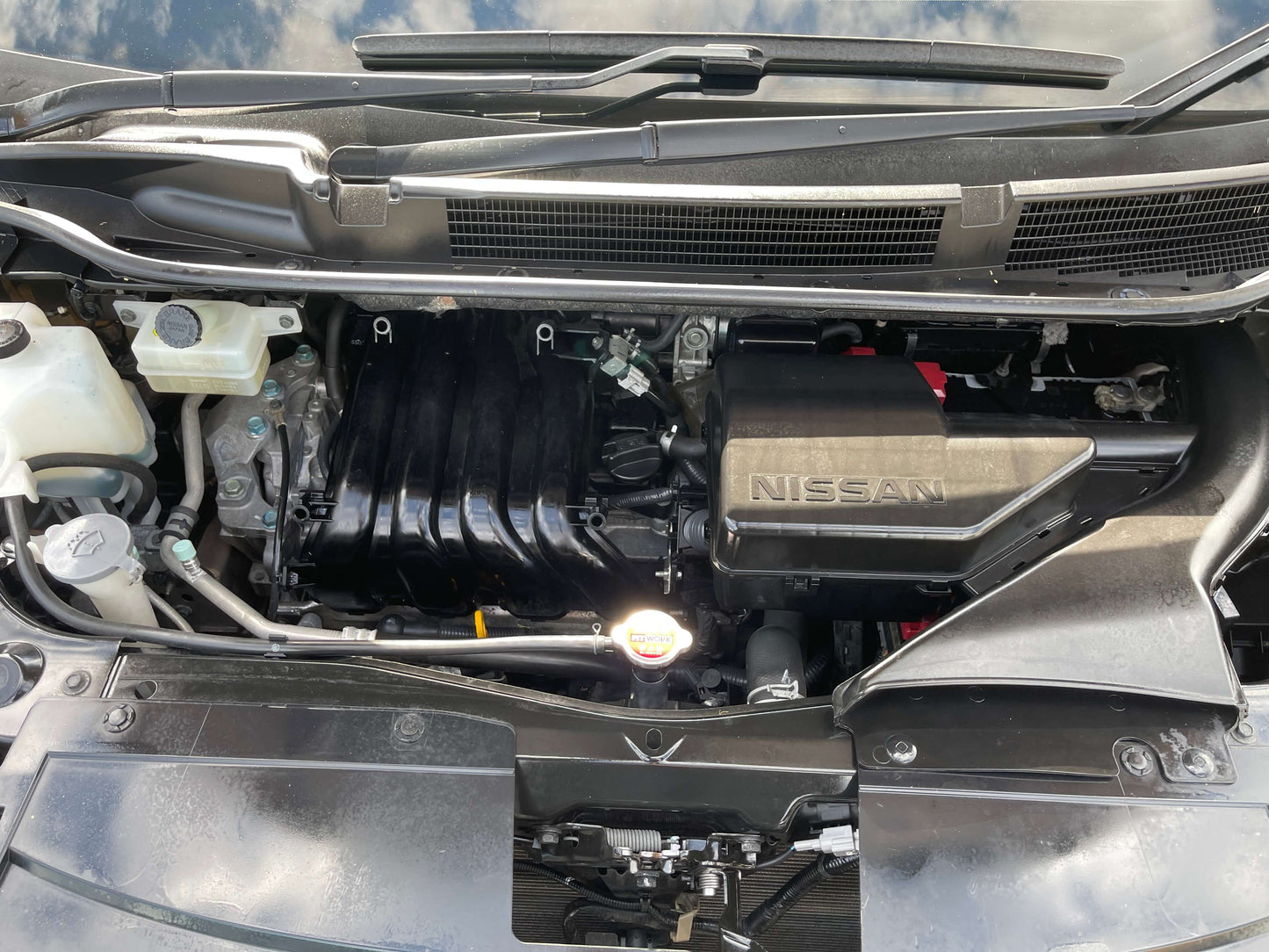 Engine compartment of a 2016 Nissan Serena 2.0L S-Hybrid, showcasing its hybrid technology and maintenance features.