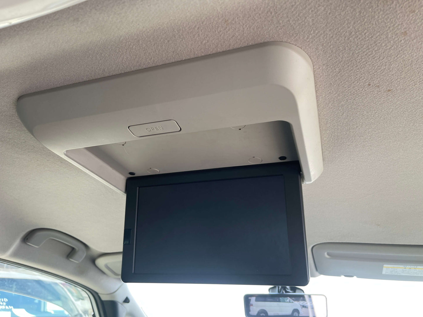 Interior view of a drop-down screen in a 2016 Nissan Serena 2.0L S-Hybrid Rider Autech Edition.