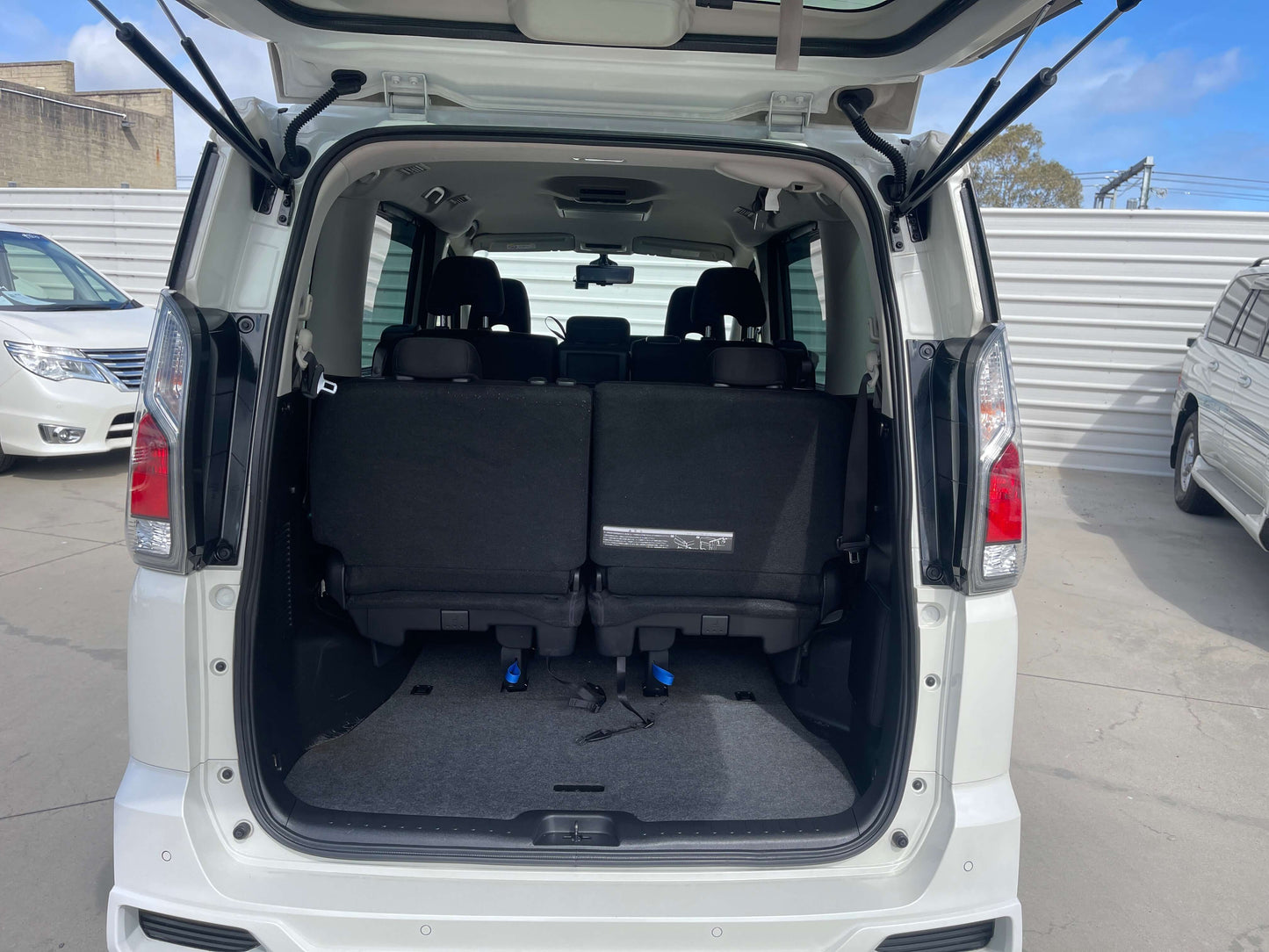 2016 Nissan Serena 2.0L S-Hybrid Rider Autech Edition interior view showcasing rear seats and cargo space.