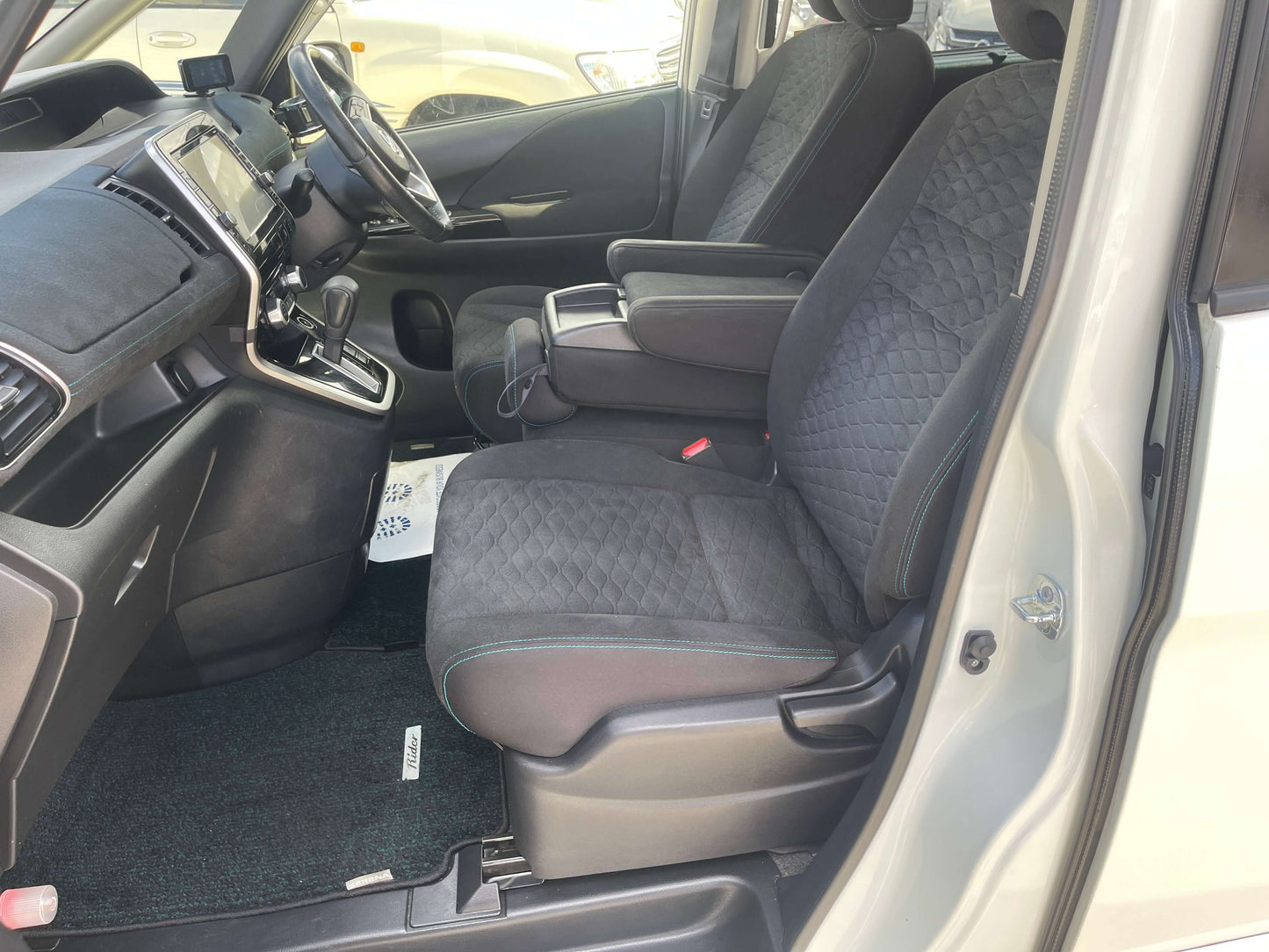 Interior view of the 2016 Nissan Serena 2.0L S-Hybrid Rider Autech Edition showing spacious seats and modern design.