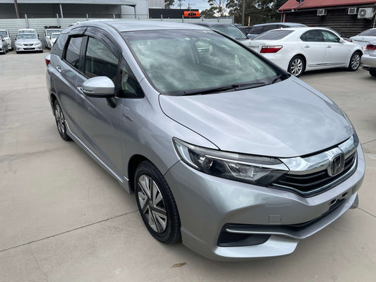 2018 Honda Shuttle 1.5 Hybrid X Honda Sensing Edition in silver, showcasing sleek design and modern features, 5-seater.