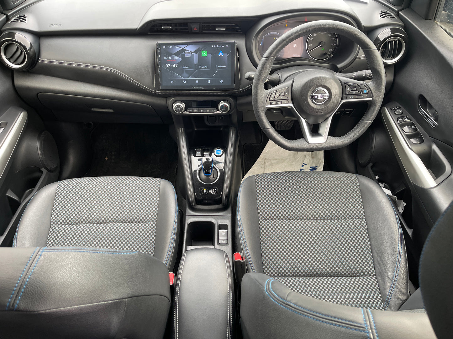 Interior view of the 2020 Nissan Kicks e-Power, featuring modern dashboard and comfortable seating.