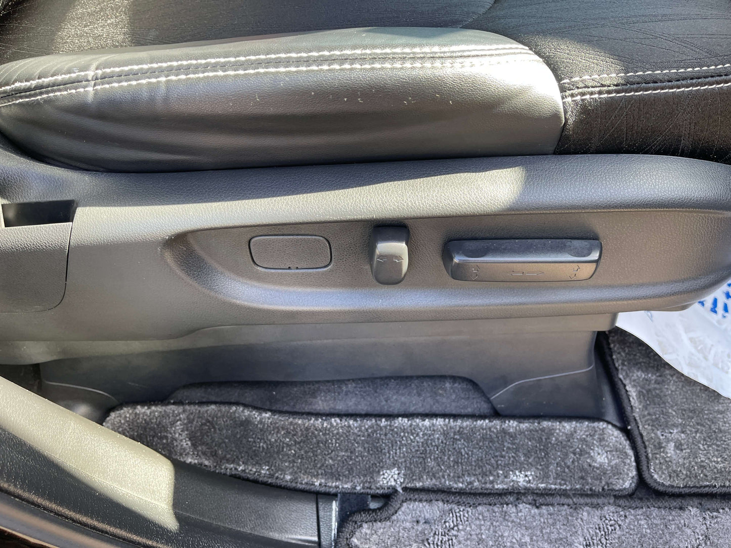 2016 Honda Odyssey 2.0 Hybrid seat adjustment controls and upholstery detail.
