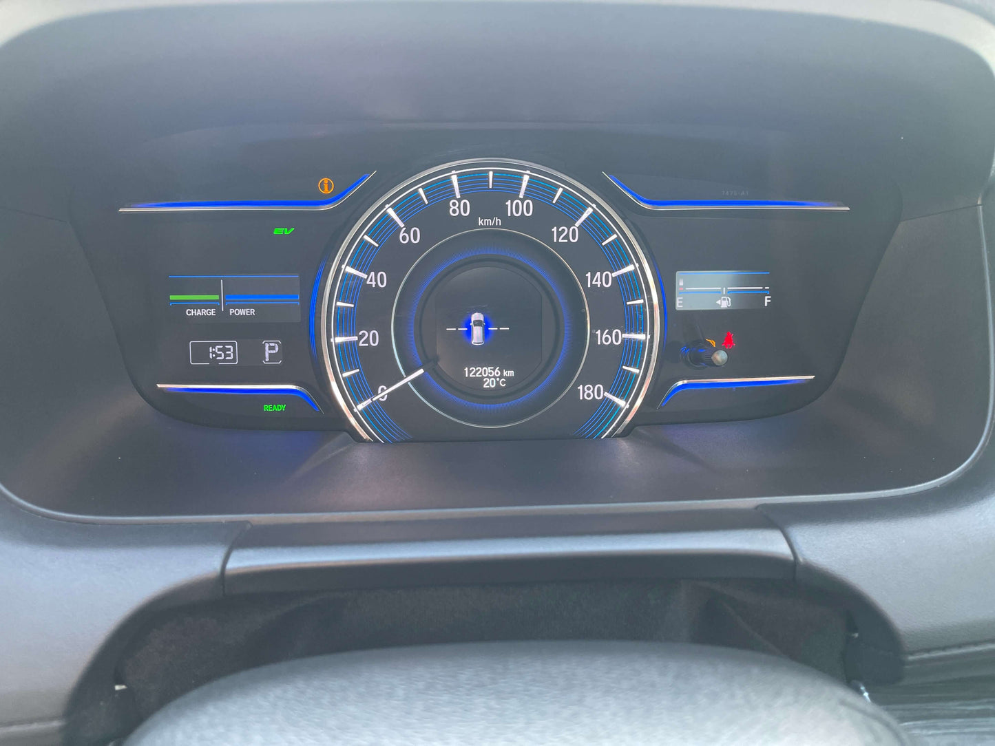 2016 Honda Odyssey 2.0 Hybrid dashboard display showing speedometer and indicators for mileage and fuel level.
