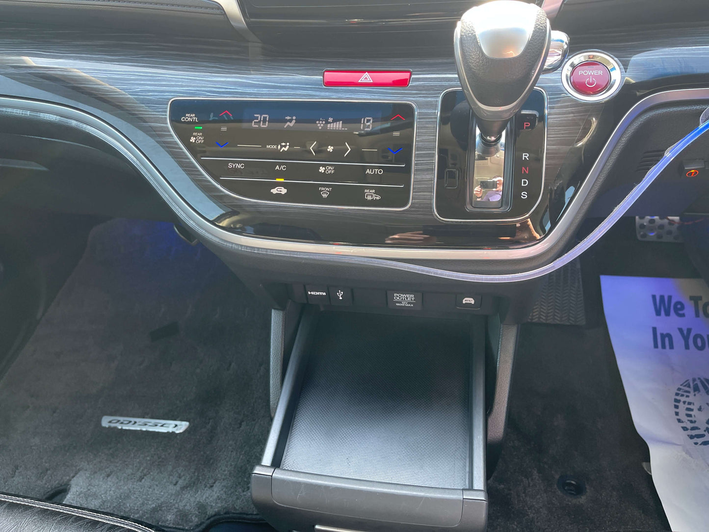Interior dashboard of 2016 Honda Odyssey 2.0 Hybrid with climate control and gear shift.