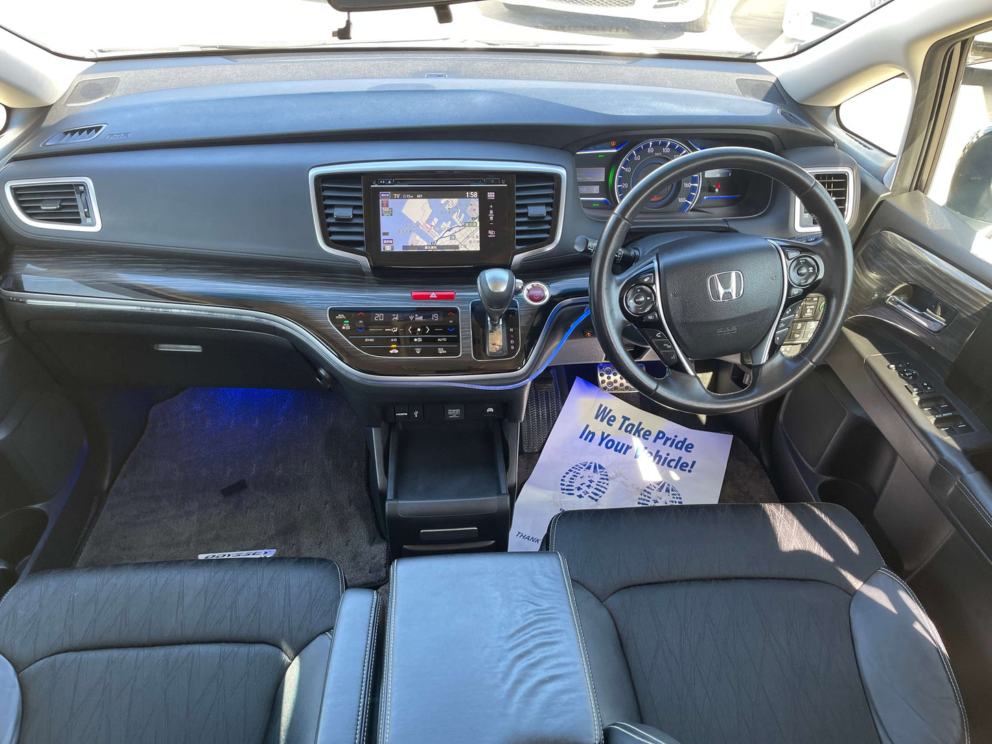 Interior view of 2016 Honda Odyssey 2.0 Hybrid Absolute Honda Sensing showing dashboard and seating.