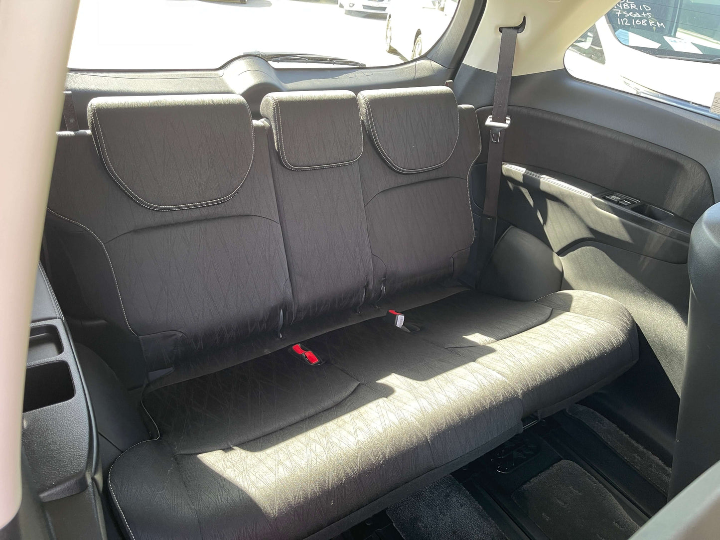 Interior of 2016 Honda Odyssey 2.0 Hybrid showing spacious back seats and seating arrangement for 7 passengers.