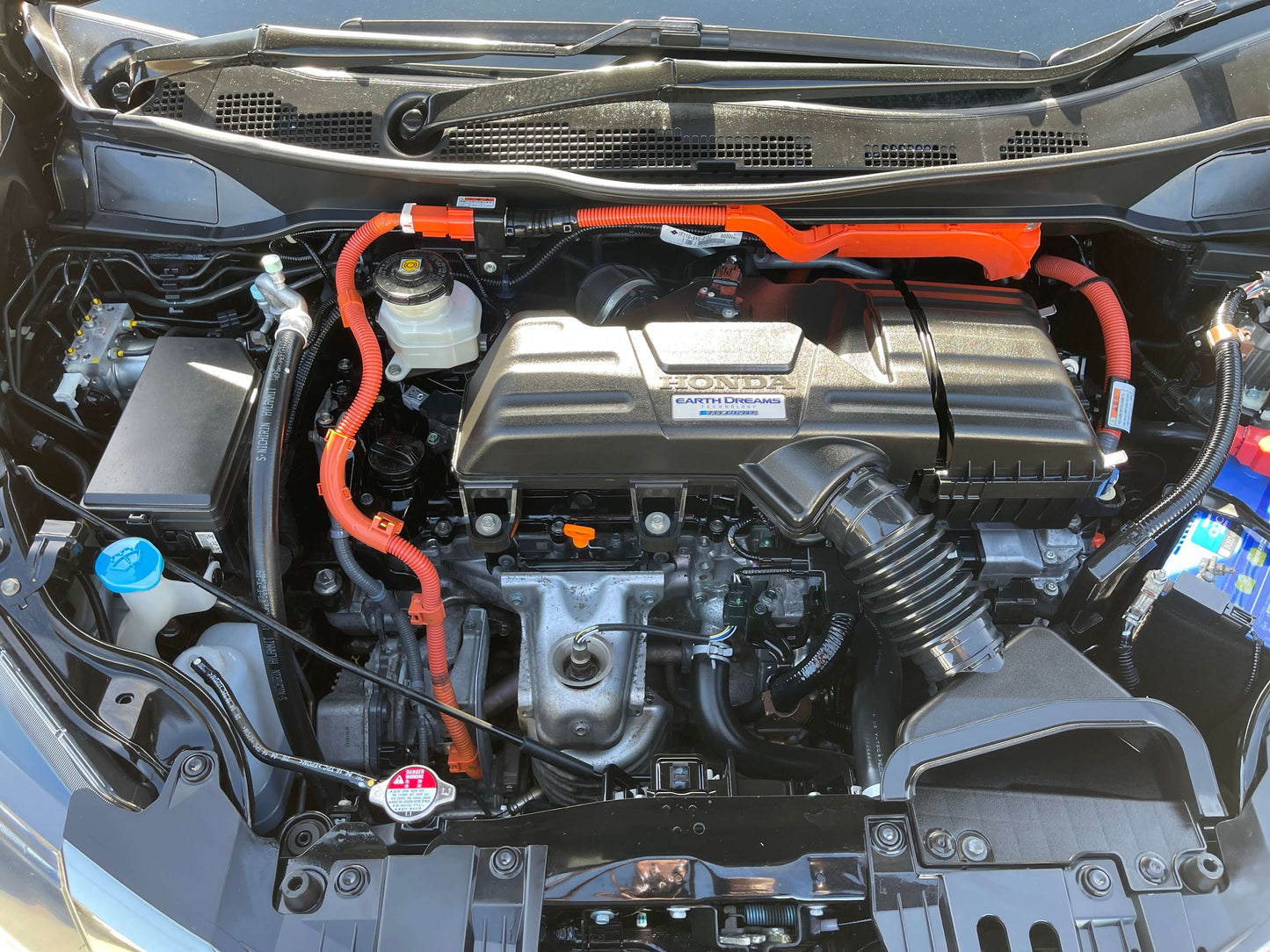 2016 Honda Odyssey 2.0 Hybrid engine compartment with visible components and wiring.