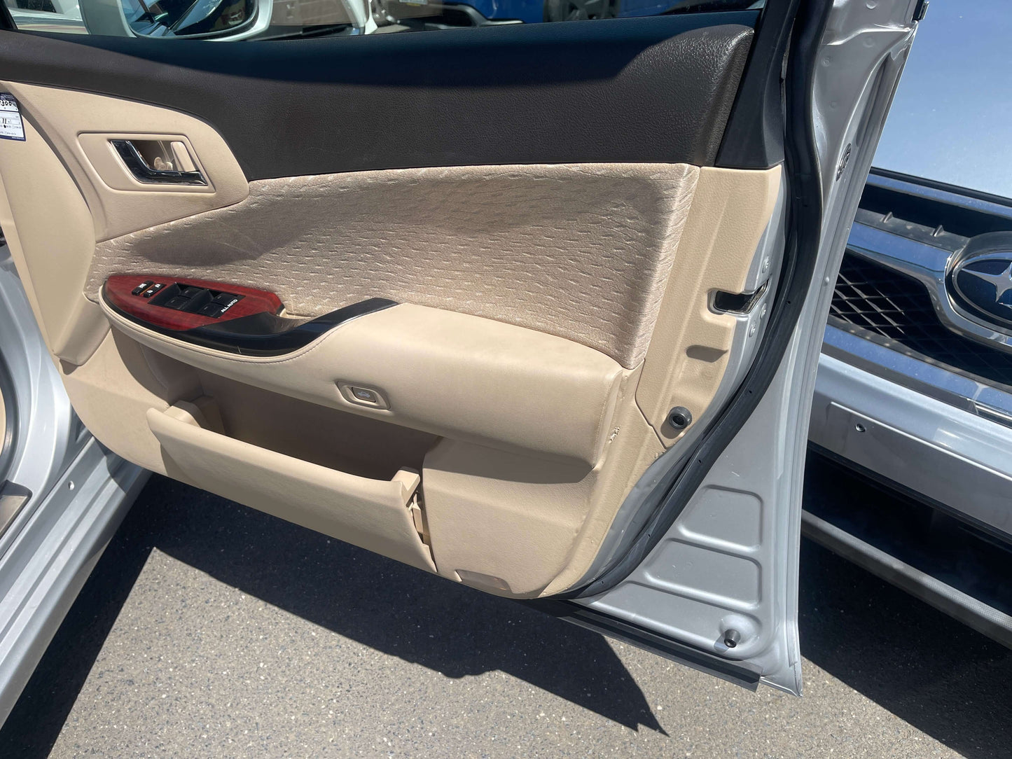 Interior view of 2008 Toyota Crown V6 3.0L Royal Saloon Luxury Sedan door panel with beige upholstery.