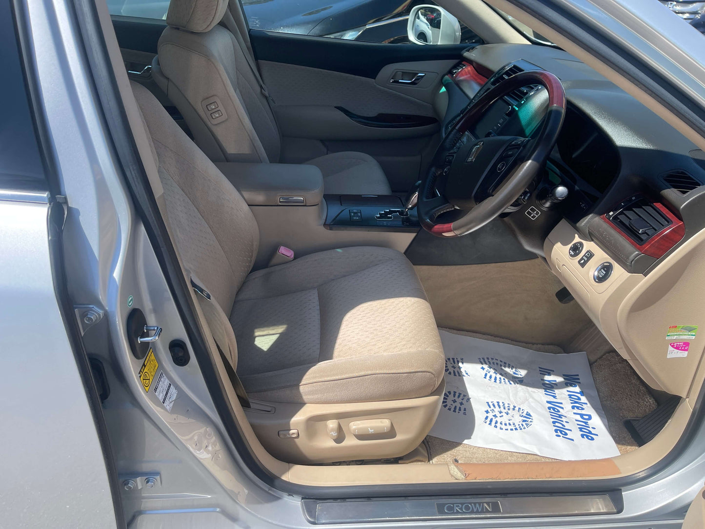 Interior view of 2008 Toyota Crown V6 3.0L Royal Saloon Luxury Sedan showing comfortable seating and controls.