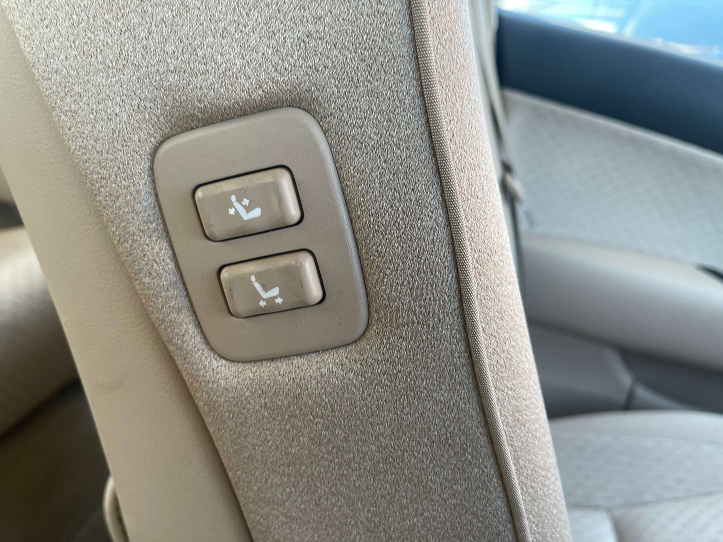 Power seat adjustment buttons in the 2008 Toyota Crown V6 3.0L Royal Saloon Luxury Sedan interior.