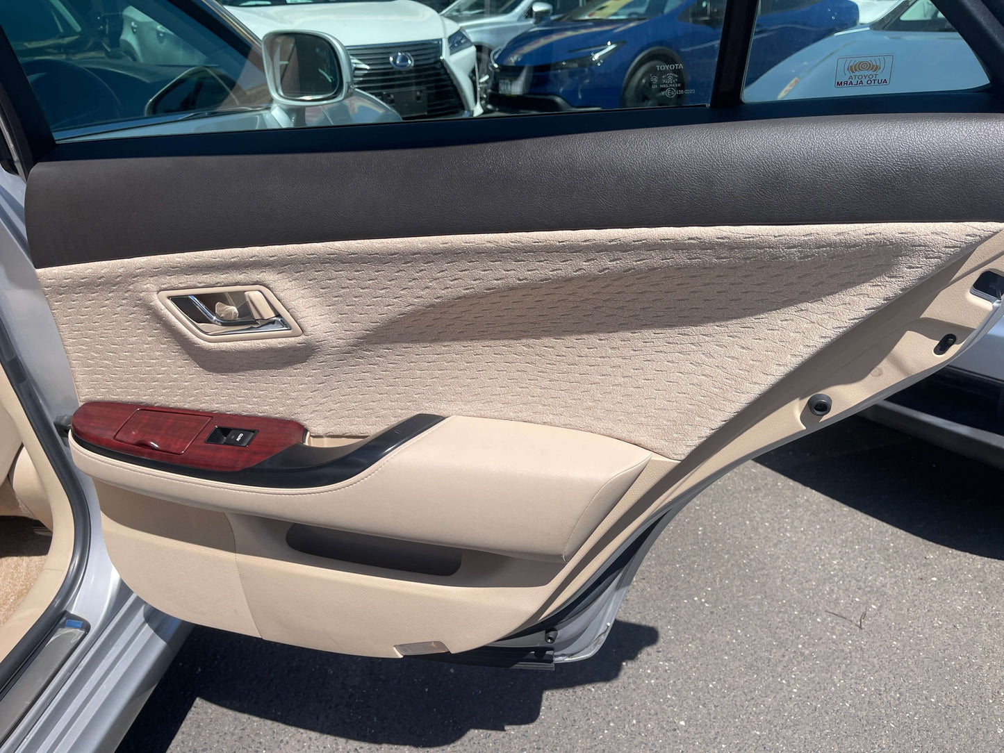 Interior door panel of a 2008 Toyota Crown V6 3.0L Royal Saloon Luxury Sedan.