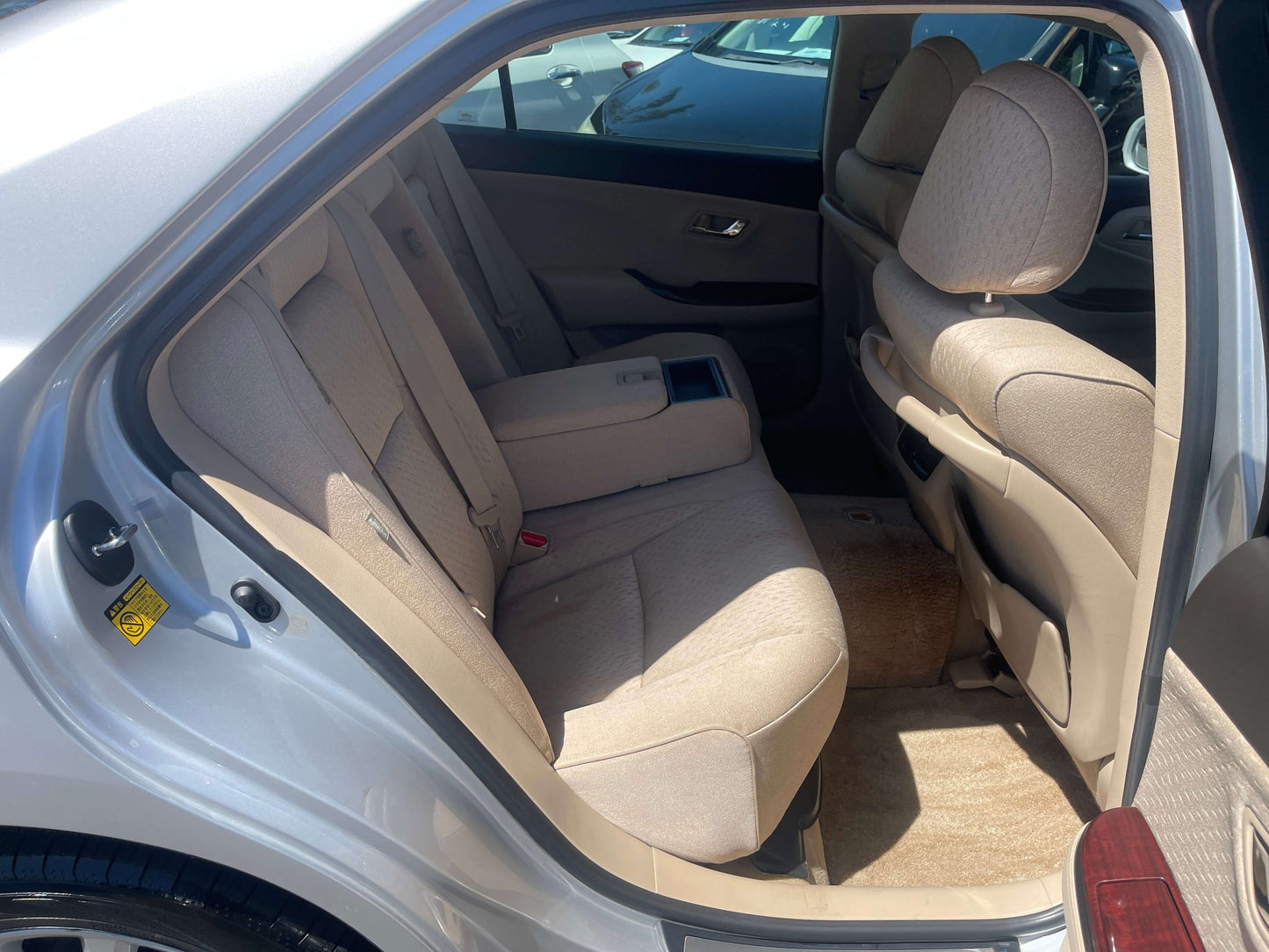 Interior view of the rear seating area in a 2008 Toyota Crown V6 3.0L Royal Saloon Luxury Sedan.