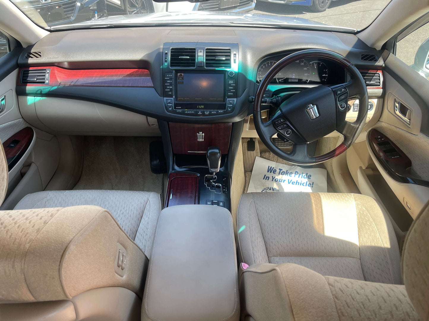 Interior view of a 2008 Toyota Crown V6 3.0L Royal Saloon Luxury Sedan featuring plush seats and modern dashboard.