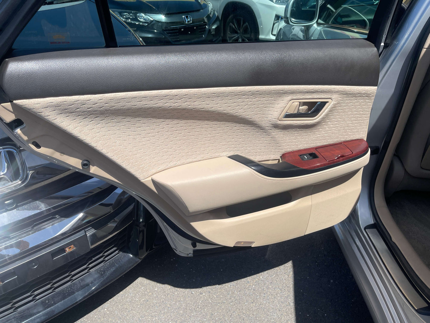 2008 Toyota Crown V6 3.0L interior door panel showing luxury features and design.
