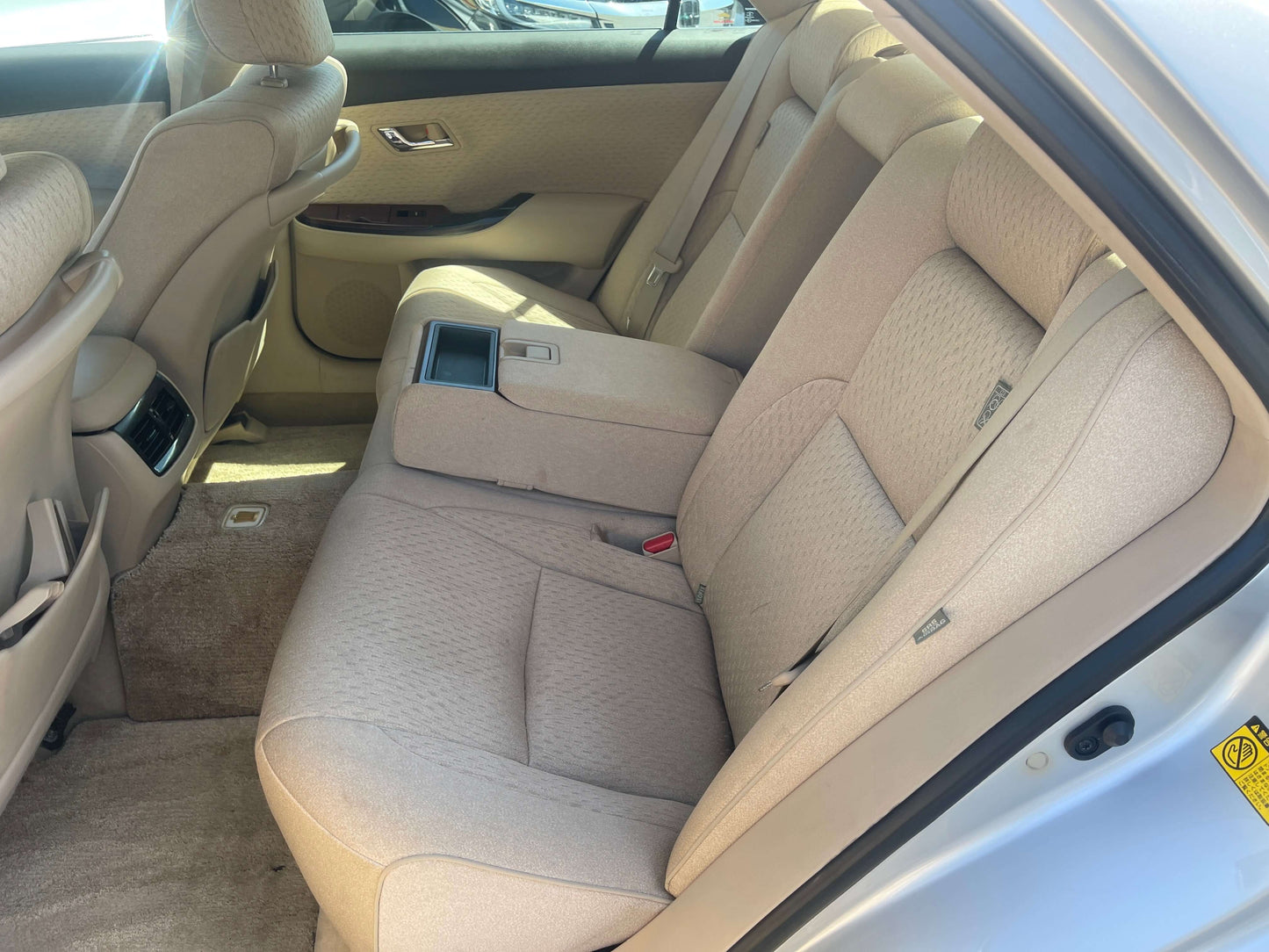 Interior view of the back seat in a 2008 Toyota Crown V6 3.0L Royal Saloon Luxury Sedan.