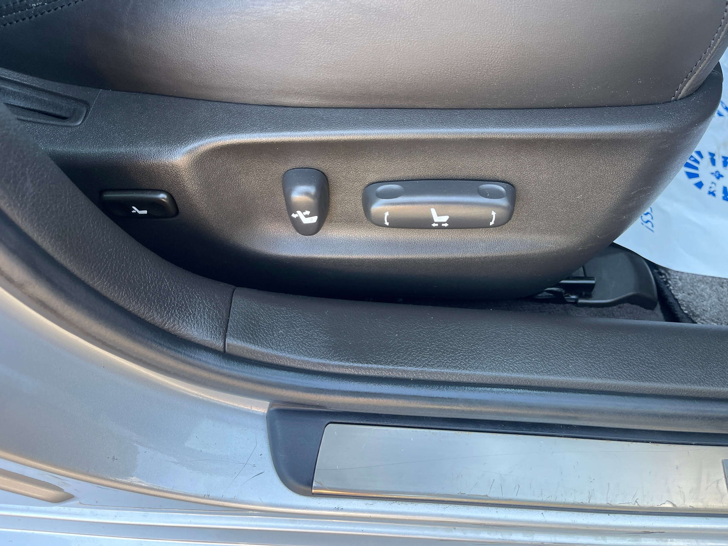 2009 Toyota Crown V6 3.5L Hybrid Luxury Sedan seat adjustment controls.