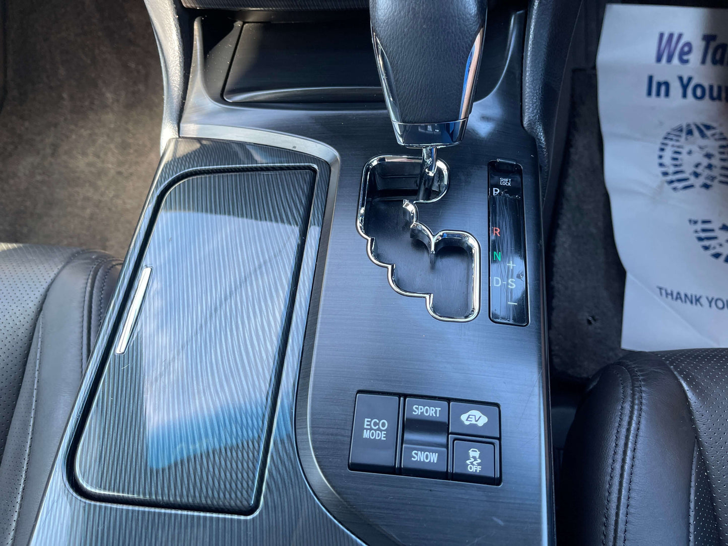 Interior view of 2009 Toyota Crown V6 3.5L Hybrid luxury sedan gear shift and controls.