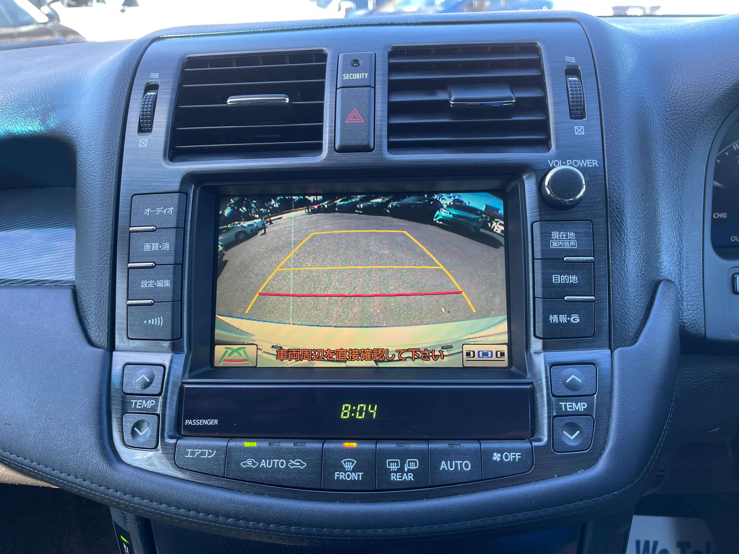 Interior dashboard view of 2009 Toyota Crown V6 3.5L Hybrid showing rearview camera display and control panel.
