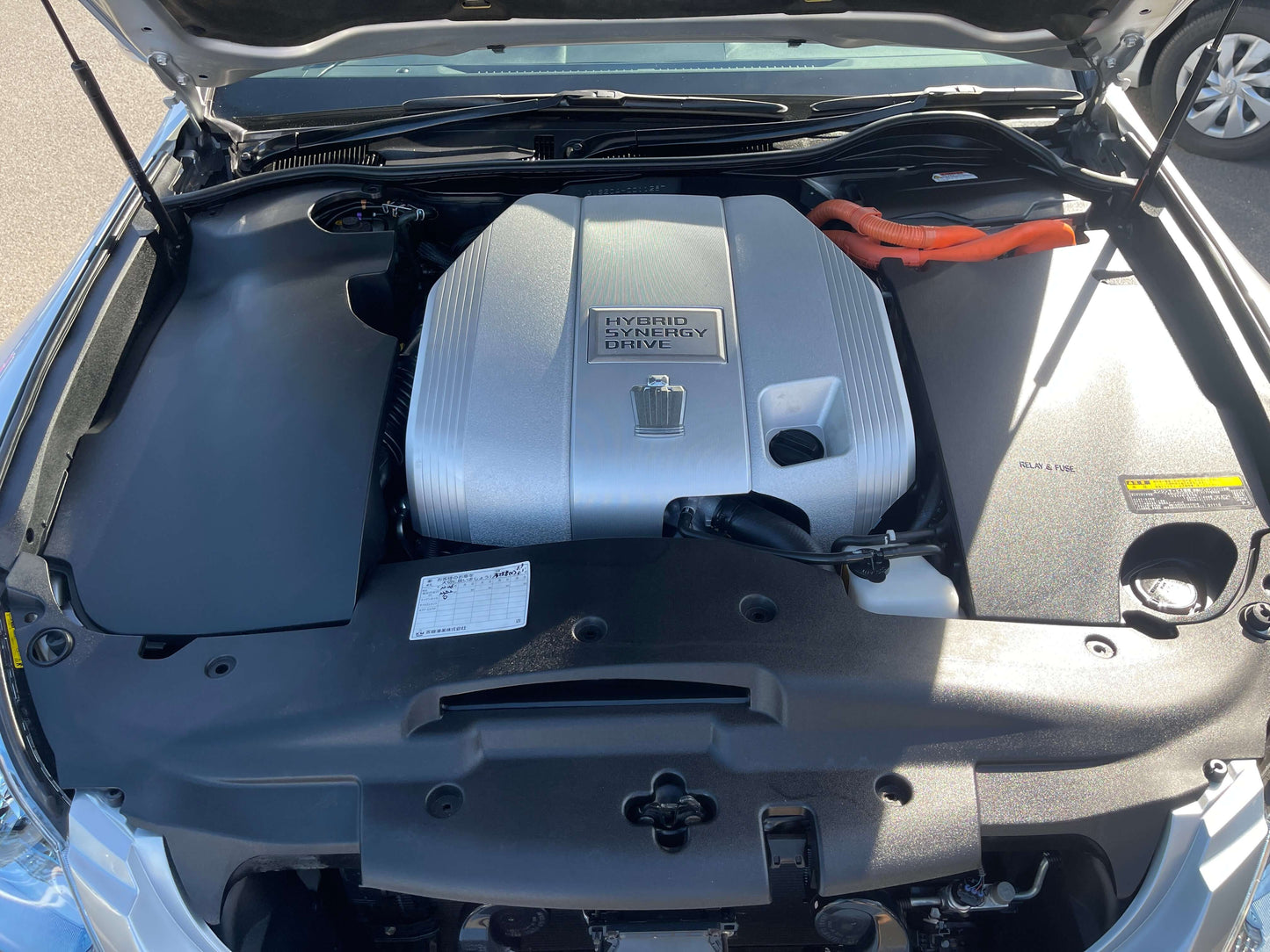 2009 Toyota Crown V6 3.5L Hybrid engine compartment showcasing the hybrid technology and components.