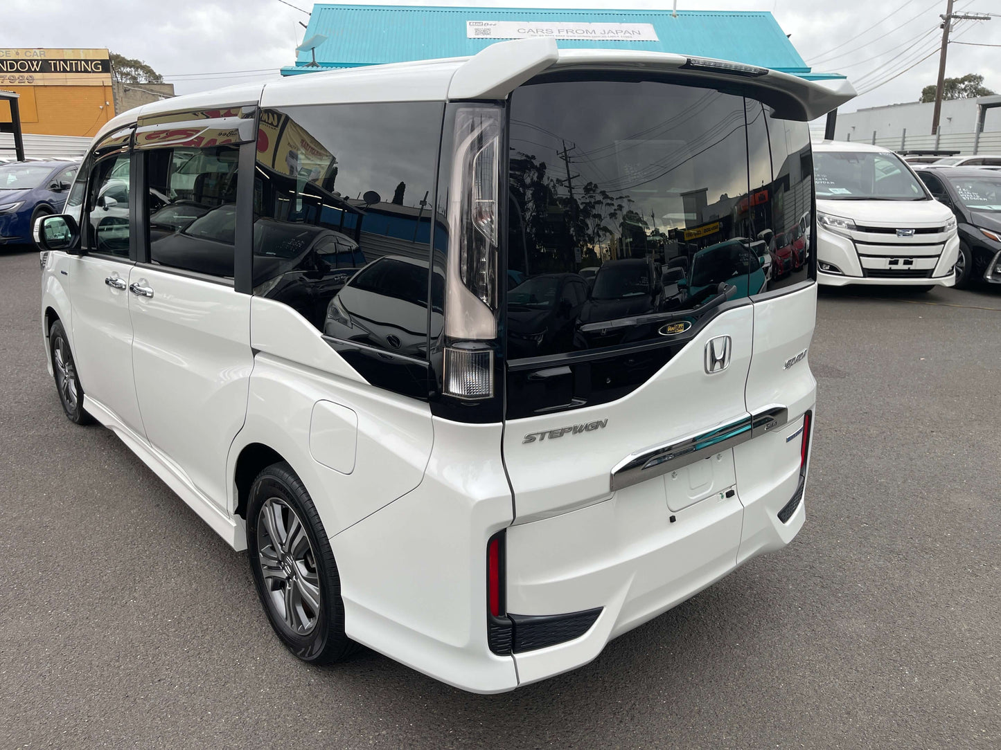 2018 Honda Honda Stepwgn 2.0 Spada Hybrid rear view, showcasing sleek design and modern features.