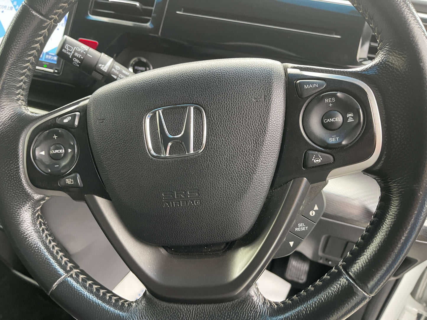 2018 Honda Honda Stepwgn 2.0 Spada Hybrid steering wheel with controls and Honda logo