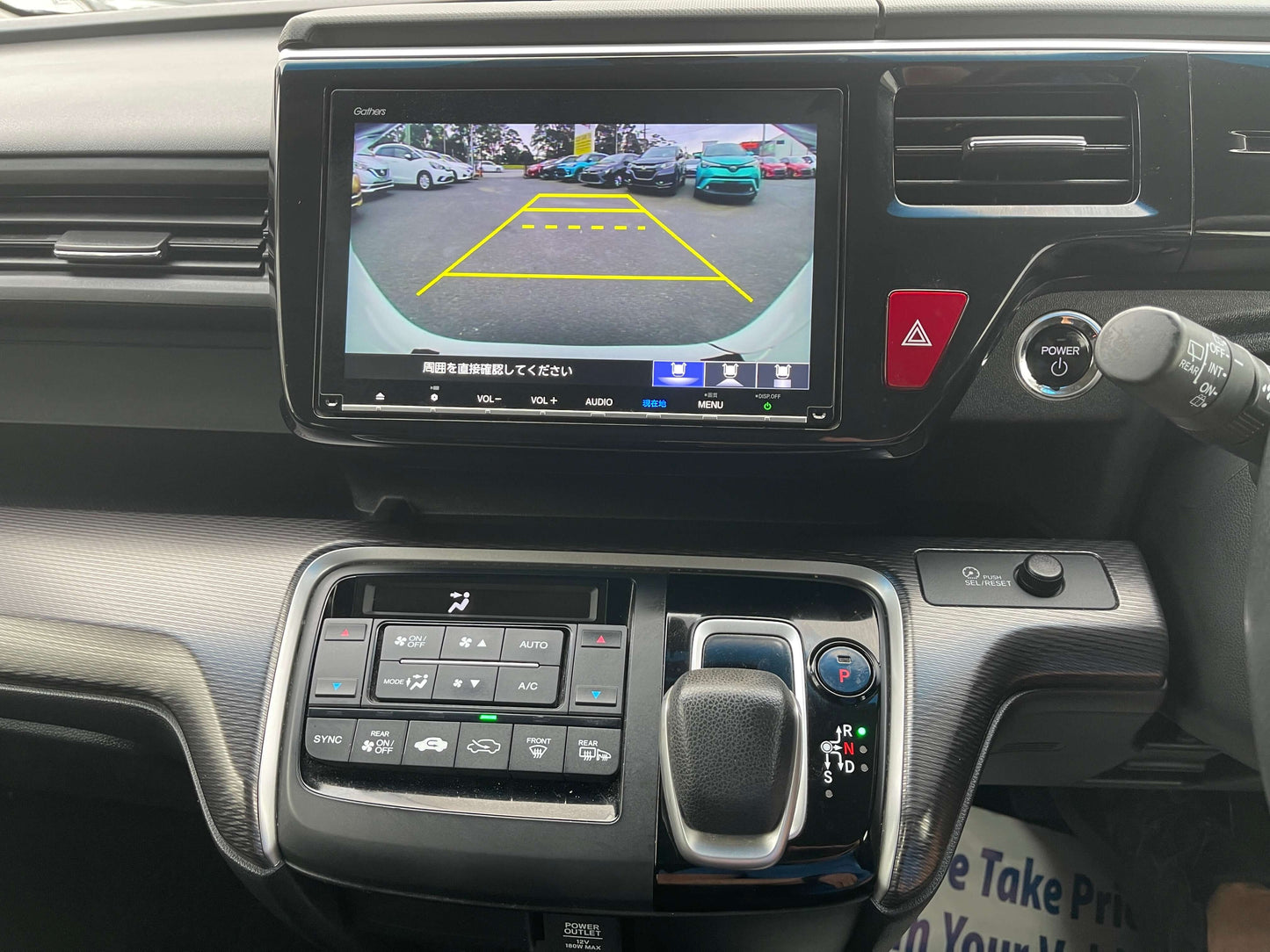 Interior view of 2018 Honda Honda Stepwgn 2.0 Spada Hybrid with infotainment screen and rearview camera display.