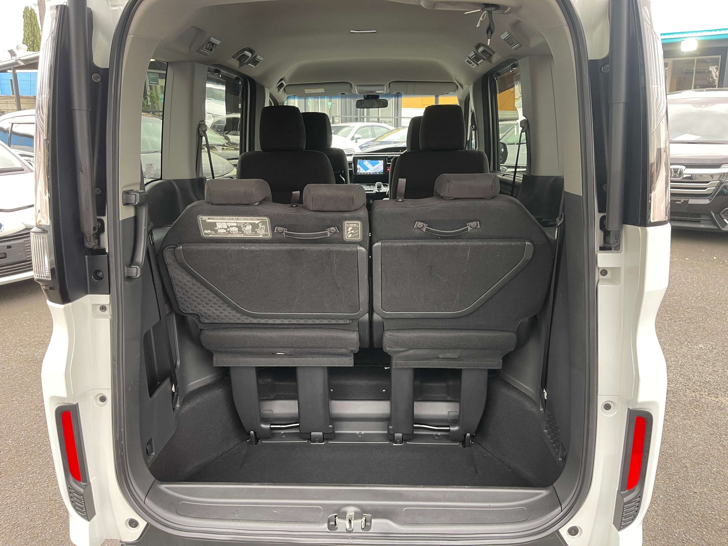 Interior view of the 2018 Honda Honda Stepwgn 2.0 Spada Hybrid showcasing seating arrangement.