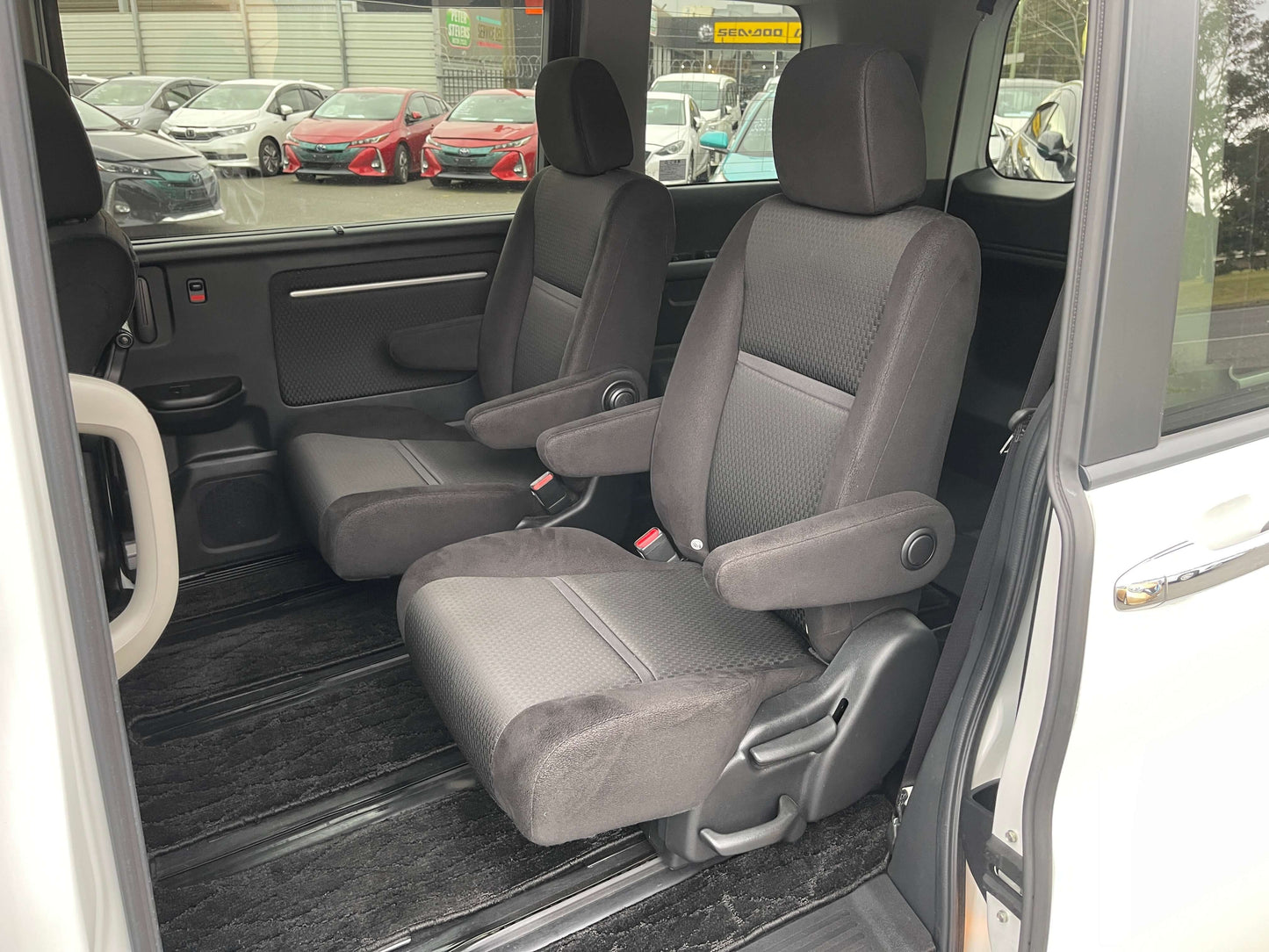 Interior seating of the 2018 Honda Honda Stepwgn 2.0 Spada Hybrid G Honda Sensing featuring comfortable black seats.