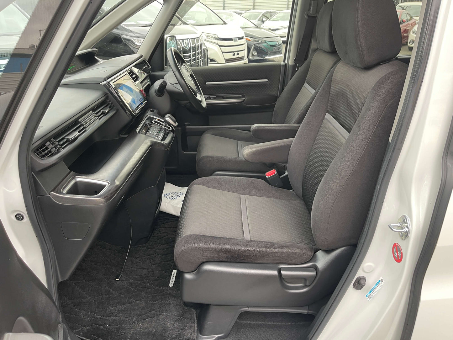 Interior view of 2018 Honda Honda Stepwgn 2.0 Spada Hybrid showing front seats and dashboard.