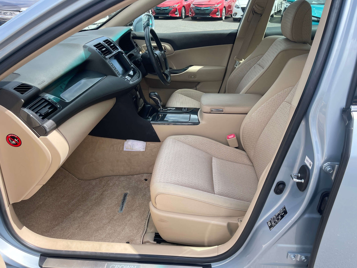 Interior view of a 2009 Toyota Crown V6 3.5L Hybrid Luxury Sedan highlighting comfortable seating and elegant design.
