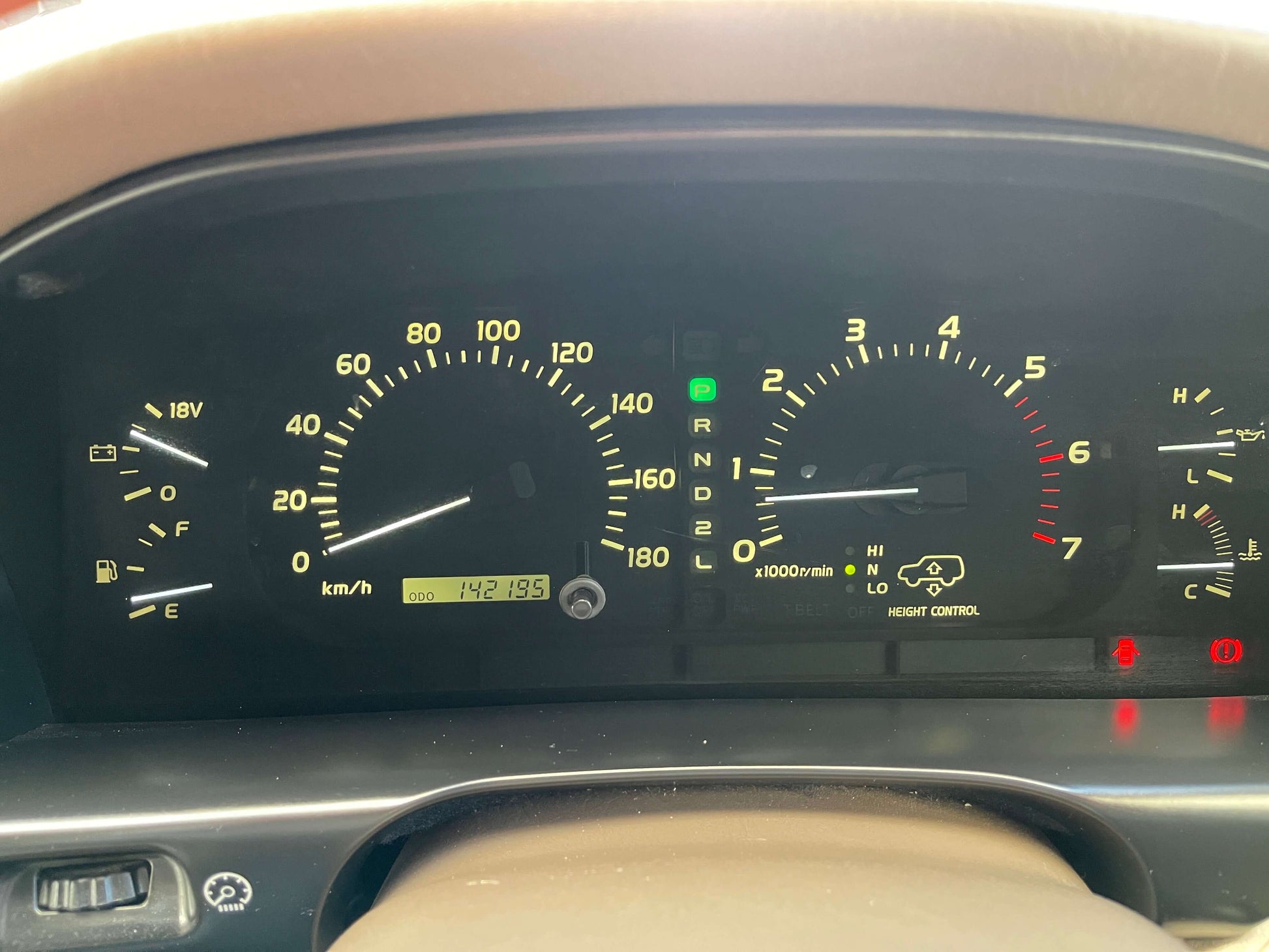 Dashboard of 1998 Toyota Land Cruiser 100 VX Limited showing mileage of 142178 km.
