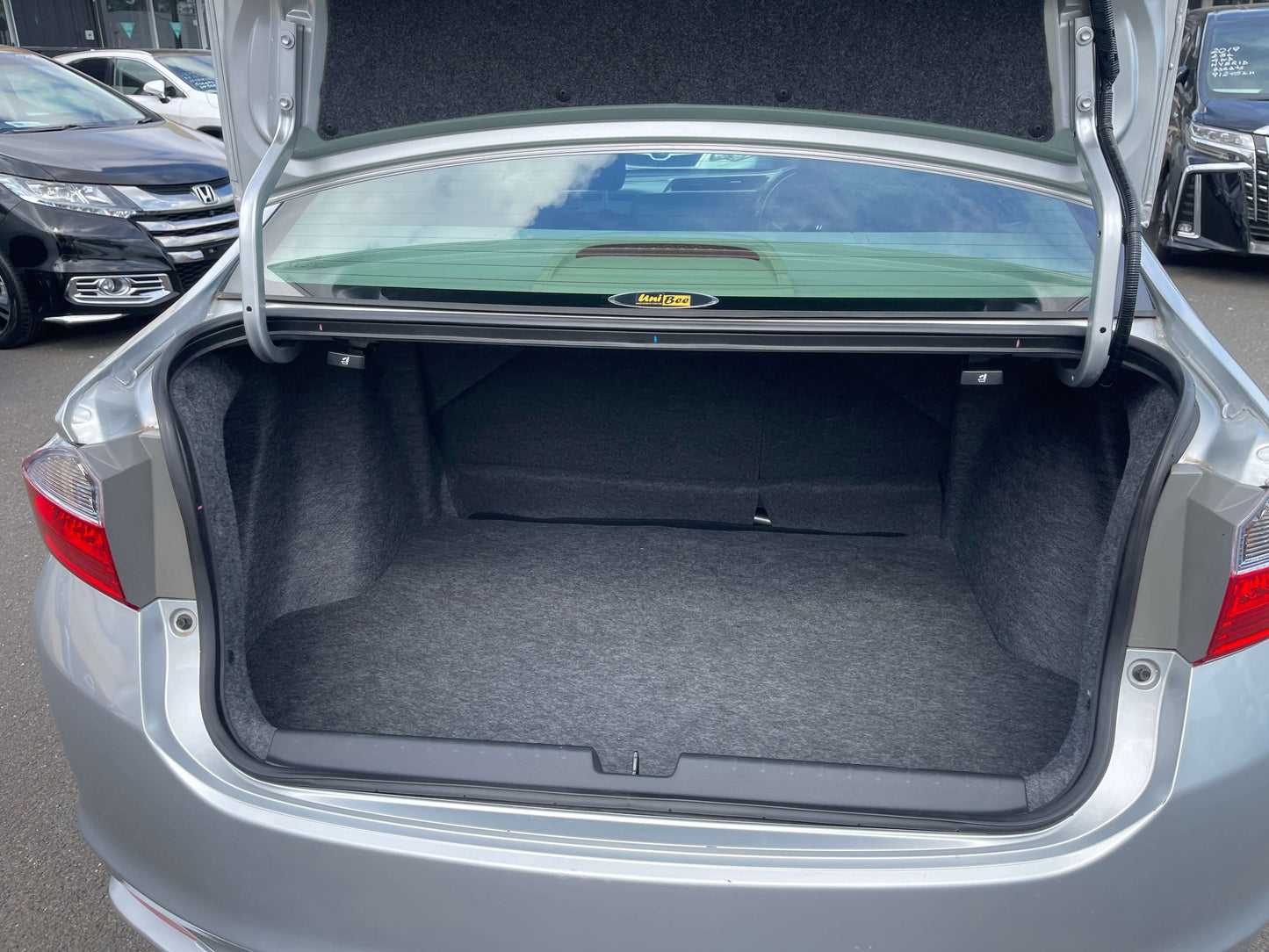 Spacious trunk of the 2015 Honda Grace 1.5 Hybrid EX sedan, showcasing ample storage capacity for convenience.