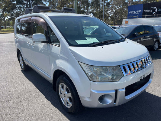 2007 Mitsubishi Delica D5 2.4L 4WD Premium Edition in silver, parked outdoors.