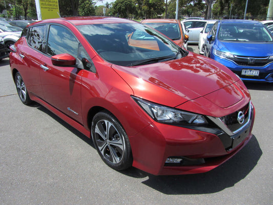 2019 Nissan Leaf 40kW G-Edition Full Electric in red parked outdoors, showcasing modern design and features.