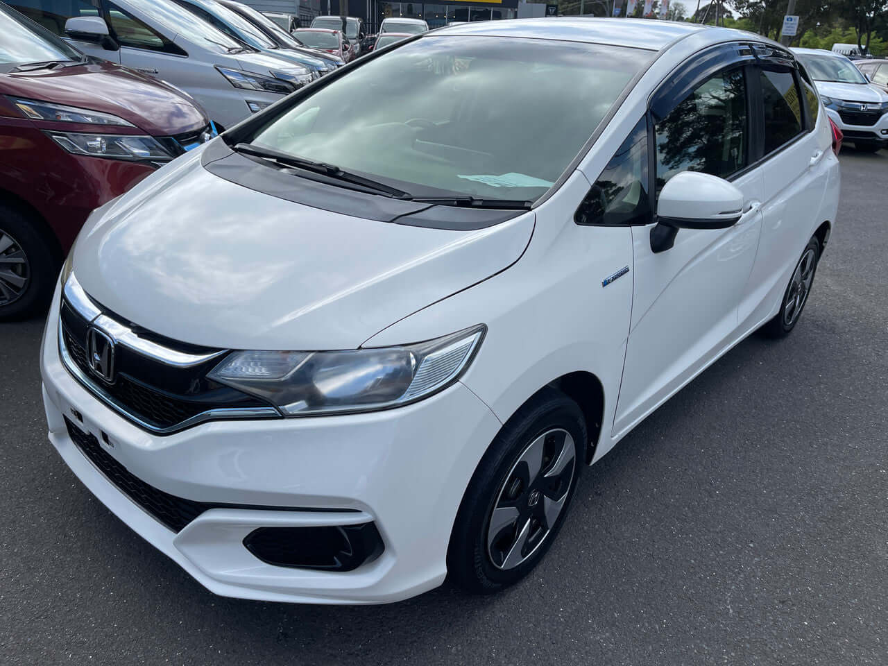 Image of a 2017 Honda Fit 1.5L Hybrid showing the exterior design and features of the 5-seater hatchback.