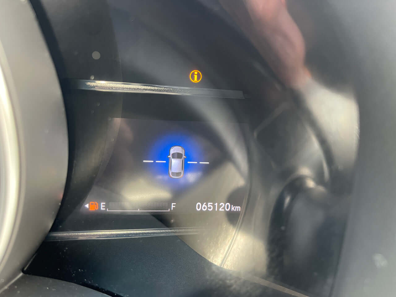 Close-up of the 2017 Honda Fit 1.5L Hybrid dashboard showing mileage at 065120 km.