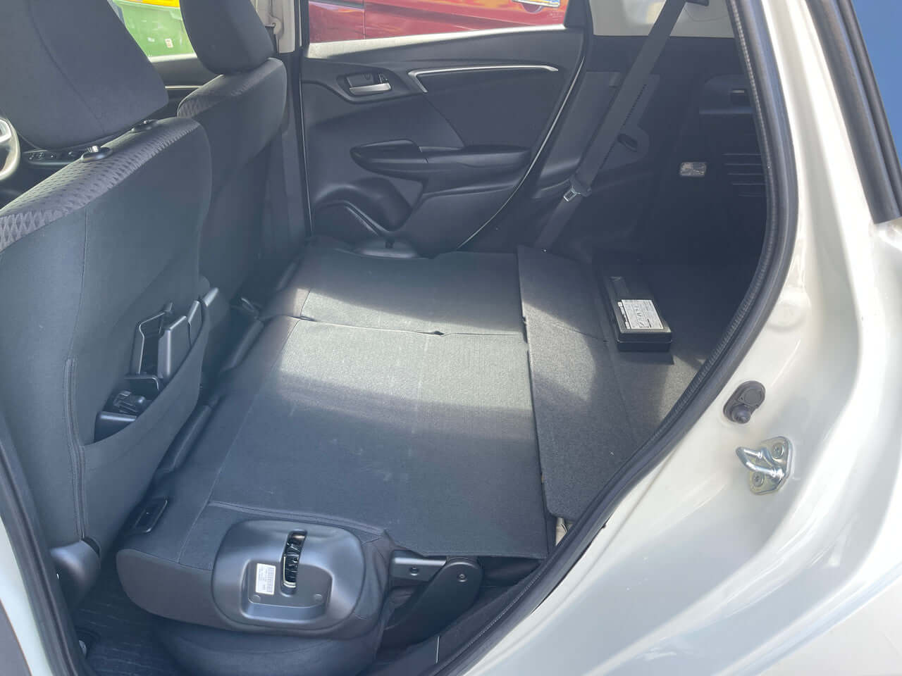 Interior view of the 2017 Honda Fit 1.5L Hybrid 5 seater showing spacious rear seating area.