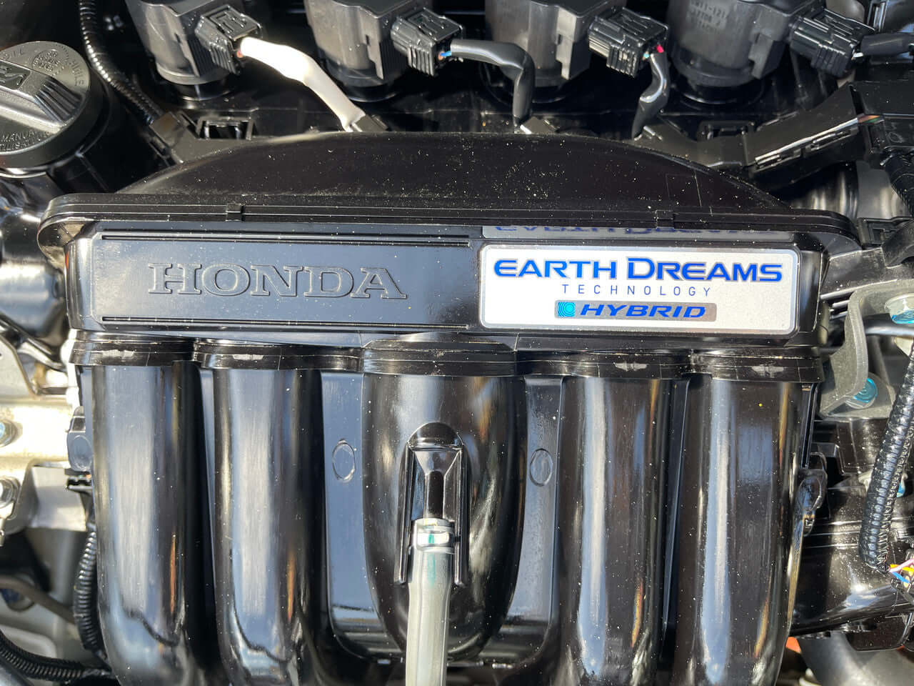 Engine of 2017 Honda Fit 1.5L Hybrid featuring Earth Dreams Technology for fuel efficiency.