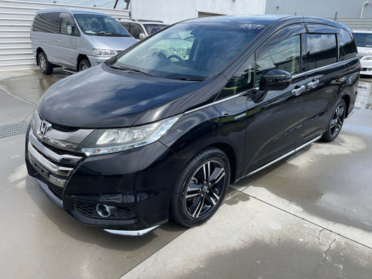 2016 Honda Odyssey 2.0 Hybrid Absolute Honda Sensing in black color with sleek design and modern features.