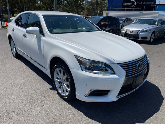 2014 Lexus LS460 AWD V8 4.6L Premium Luxury Sedan parked in a parking lot, showcasing its elegant design and sleek profile.
