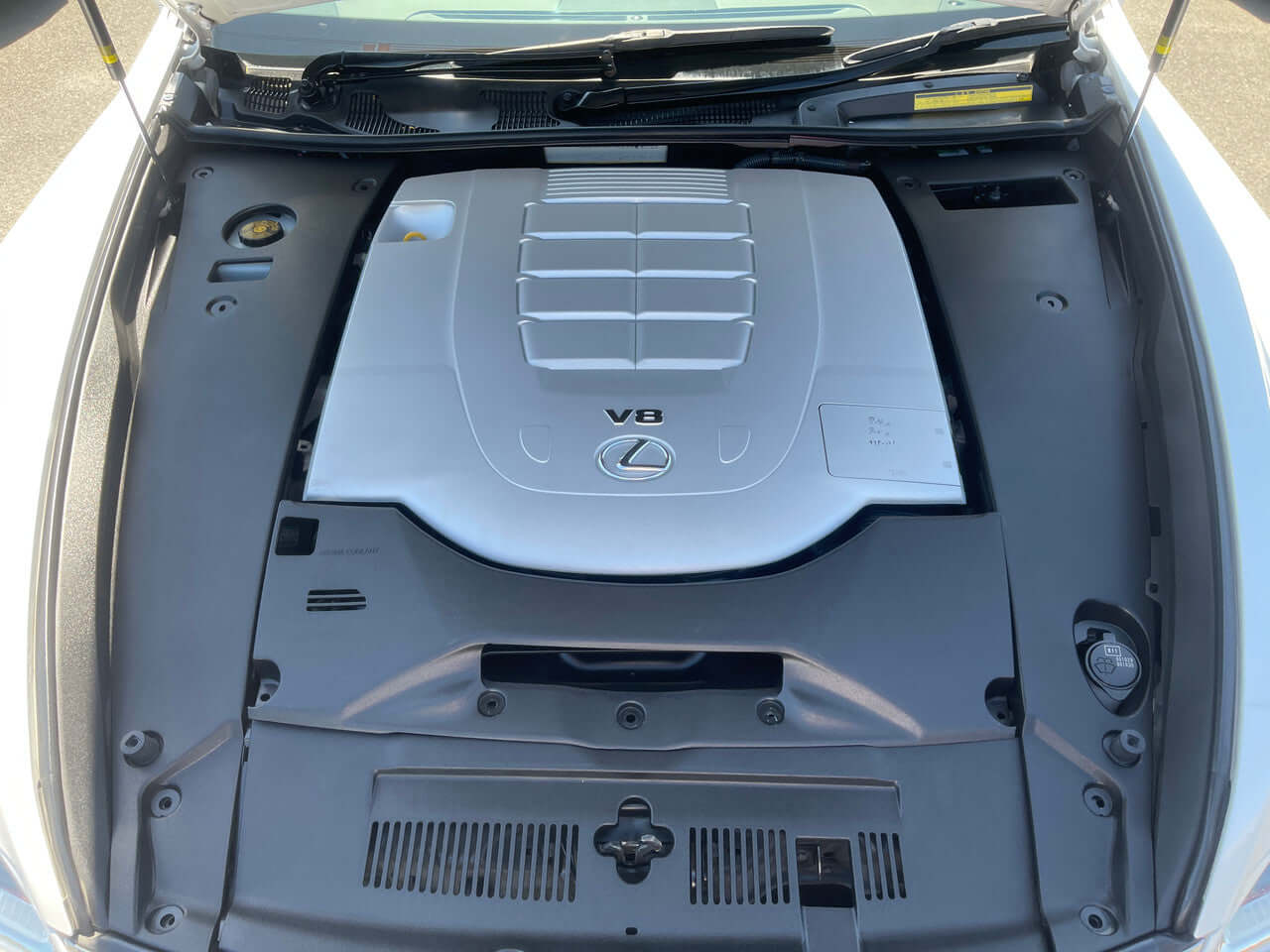 Engine view of the 2014 Lexus LS460 AWD V8 4.6L showcasing its V8 engine components.