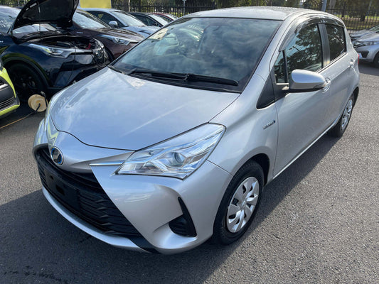 2017 Toyota Vitz 1.5L Hybrid, silver exterior, showcasing front and side view, compact hatchback design.