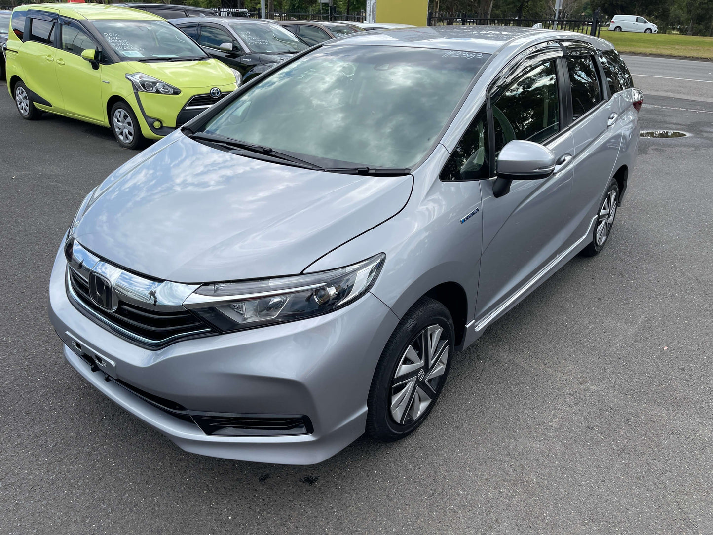 2019 Honda Shuttle 1.5L 4WD Hybrid X Honda Sensing Edition in silver color, parked on a street.
