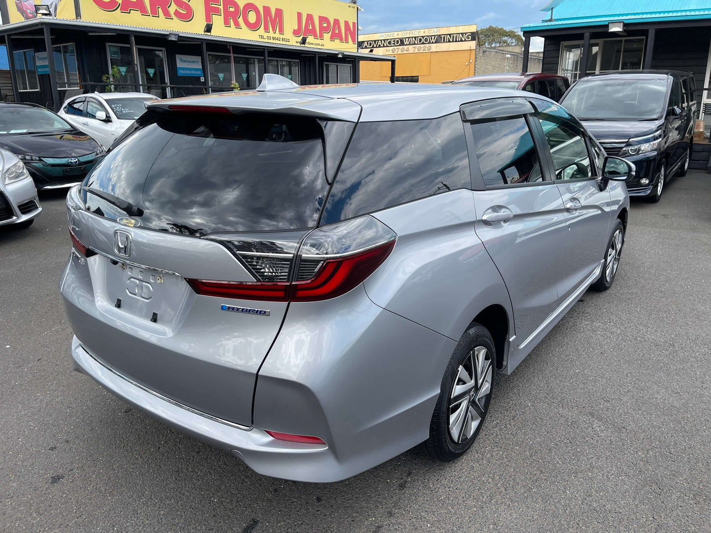 2019 Honda Shuttle 1.5L 4WD Hybrid X Honda Sensing Edition in silver, showcasing its sleek design and hybrid features.