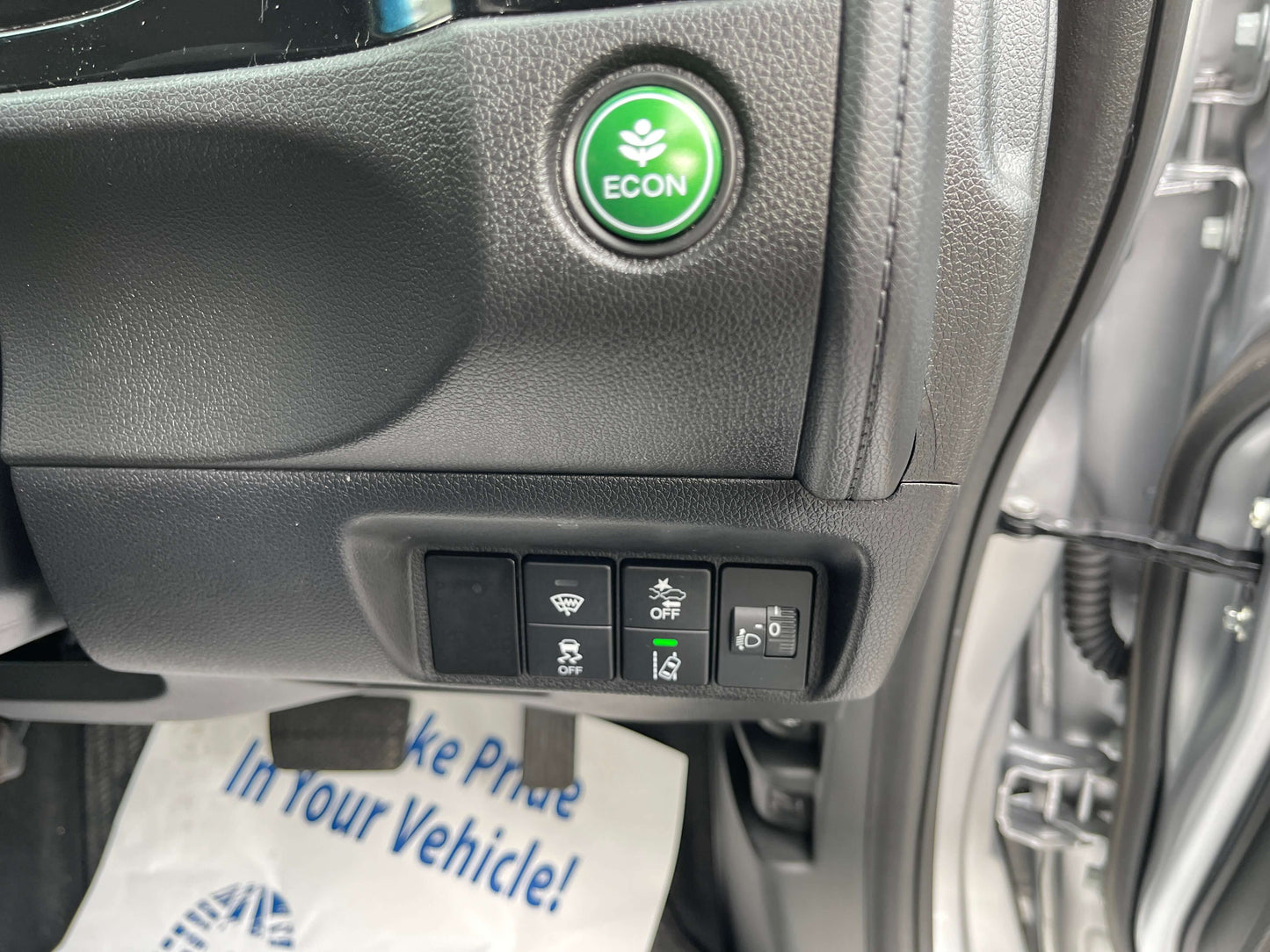 2019 Honda Shuttle 1.5L 4WD Hybrid interior controls including ECON button and various feature switches.